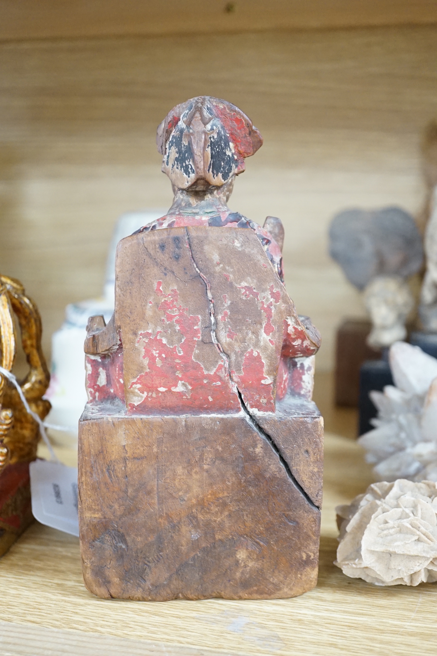 A Chinese lacquered wood figure of a seated woman and a Buddhist lion, tallest 20.5cm